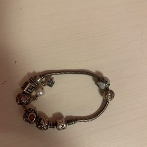Silver Pandora charmed bracelet.